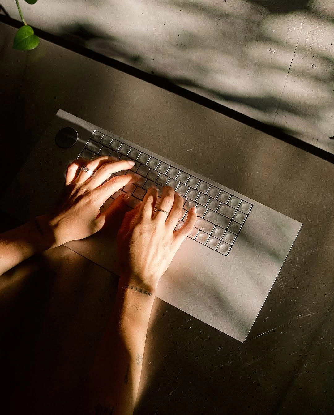 Two hands on a laptop